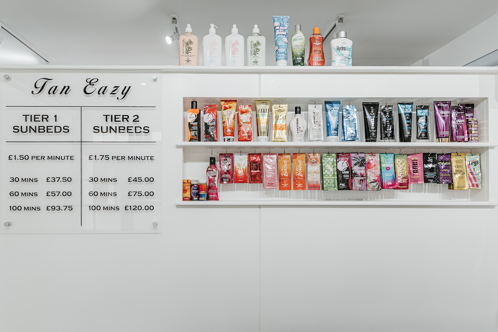 Tan Eazy lotion programme on the wall: Karat, Hempz, California Tan and more